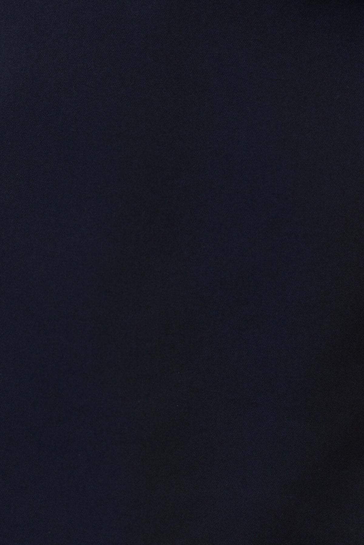 Close-up of a black fabric, showcasing a smooth texture suitable for fashion apparel.