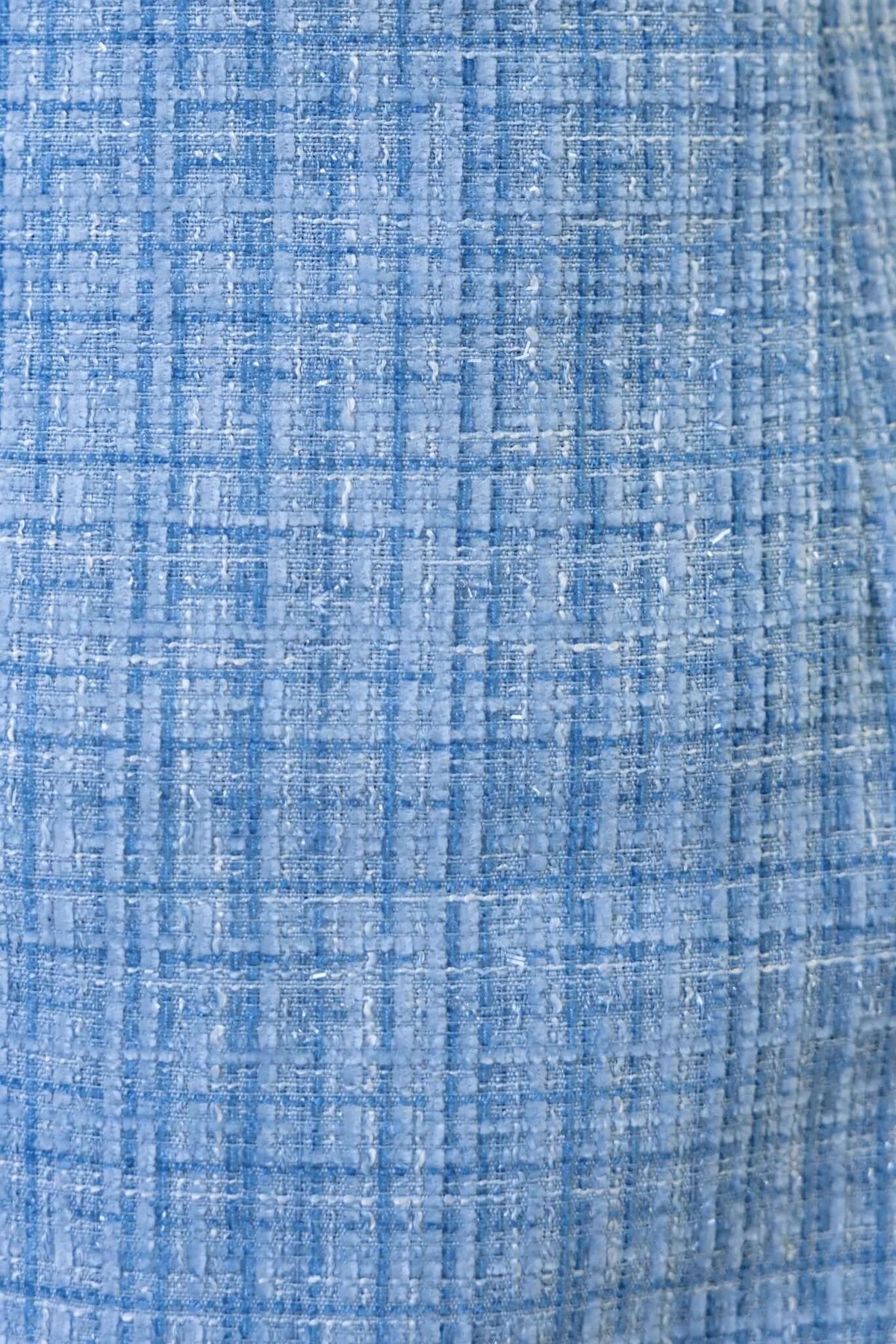 Close-up of blue chenille fabric with a textured plaid pattern, ideal for the Manhattan Dress style.