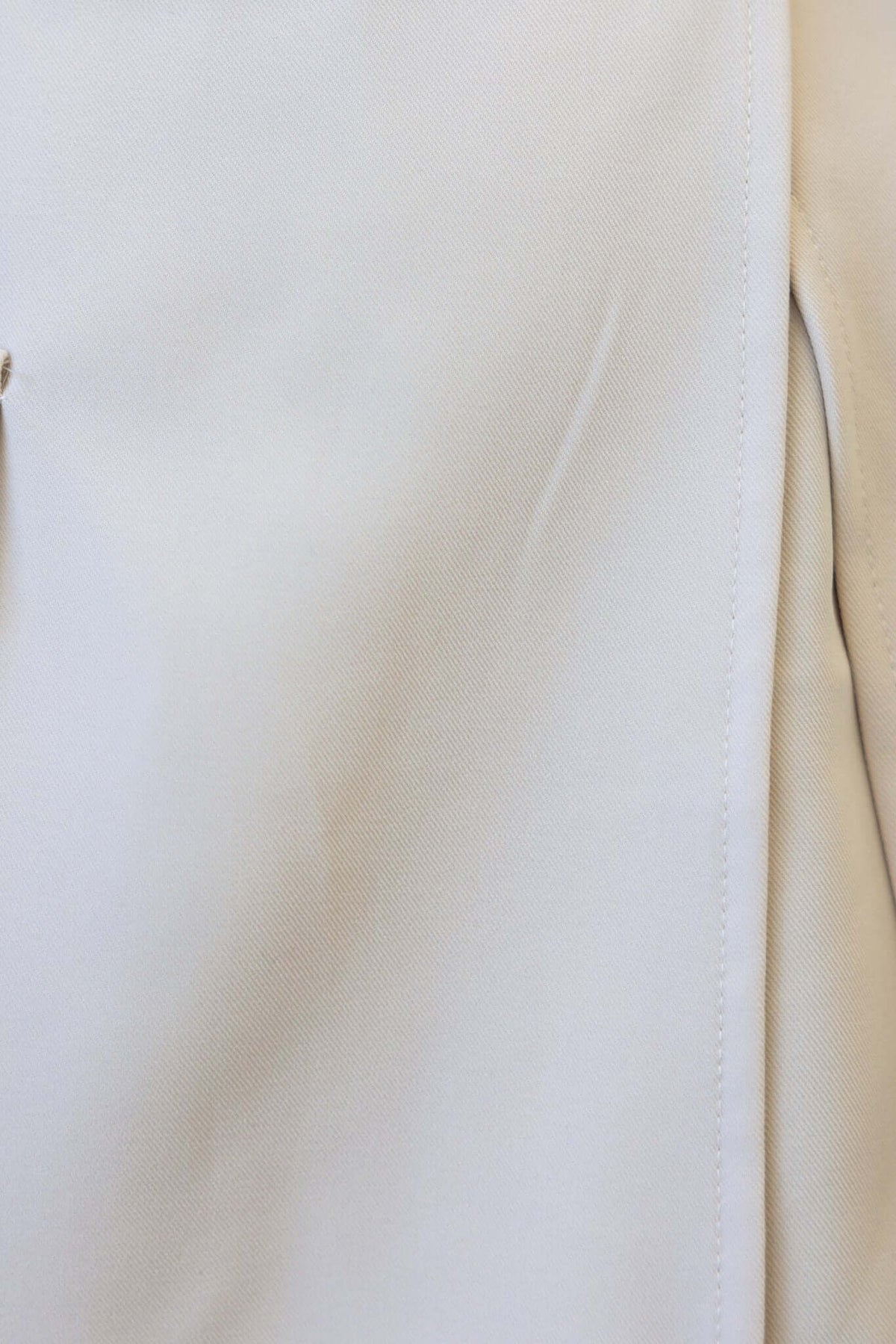 Close-up of the Martel Playsuit, showcasing its smooth fabric and stylish design in a neutral color.