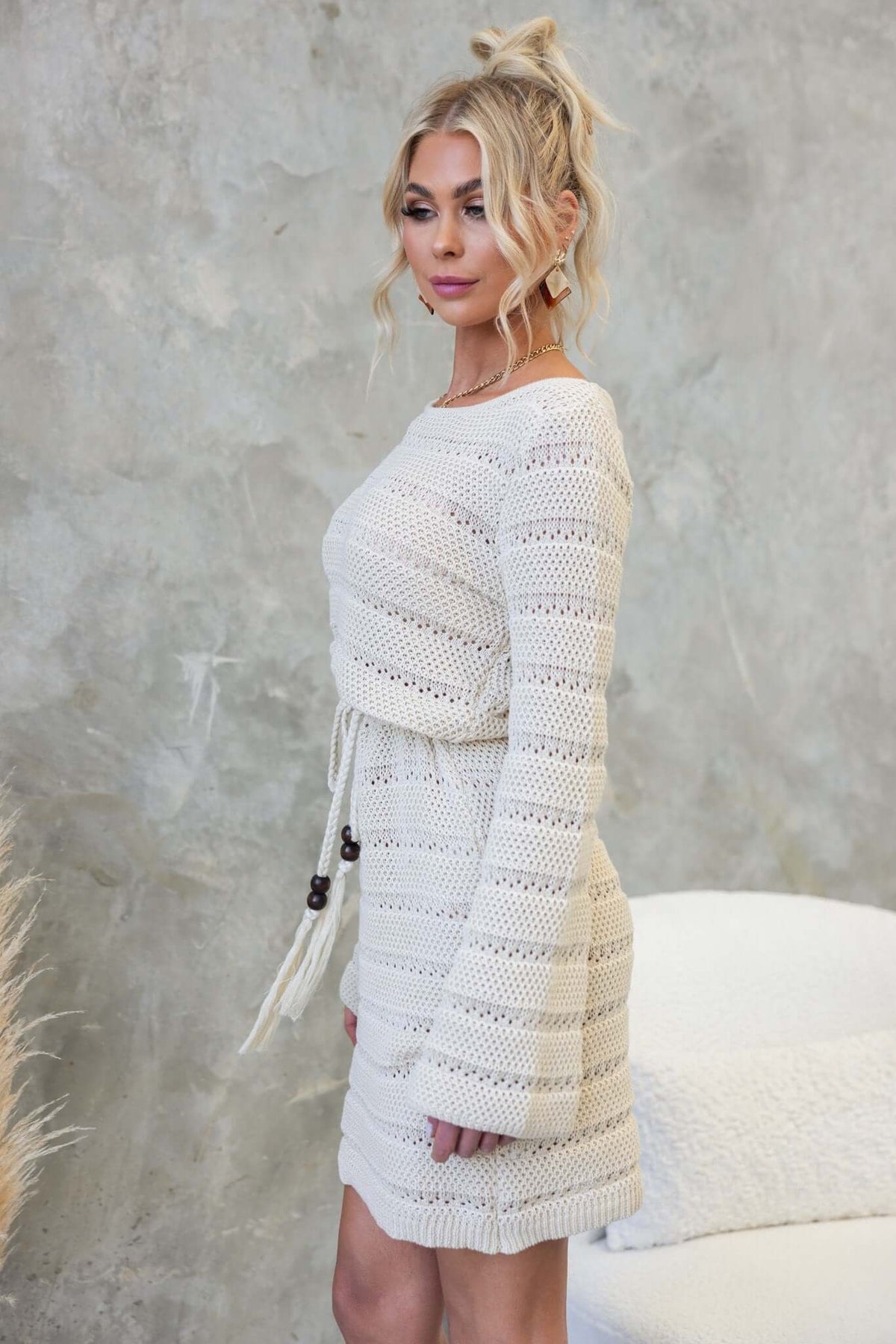 Side view of the Dunne Dress featuring a round neckline, crochet material, and removable tie, styled with relaxed fit.