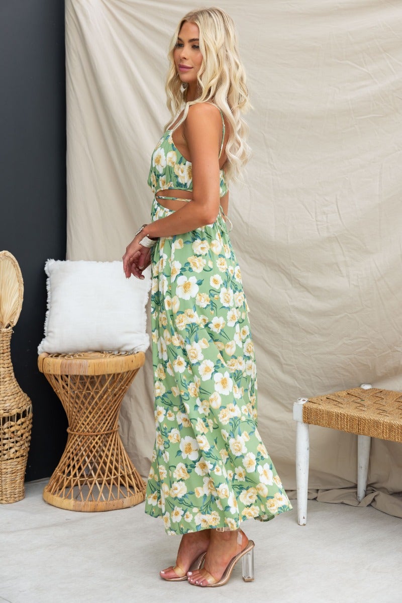 Floral print Juliette maxi dress with adjustable straps and cut-out waist, styled for summer outfits.