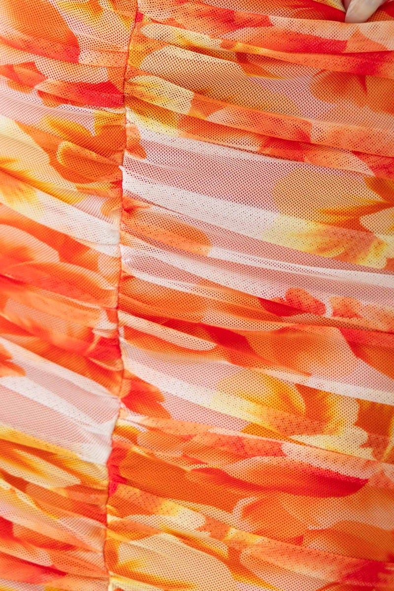 Close-up of ruched mesh overlay in vibrant orange floral print for Zachia Maxi Dress.