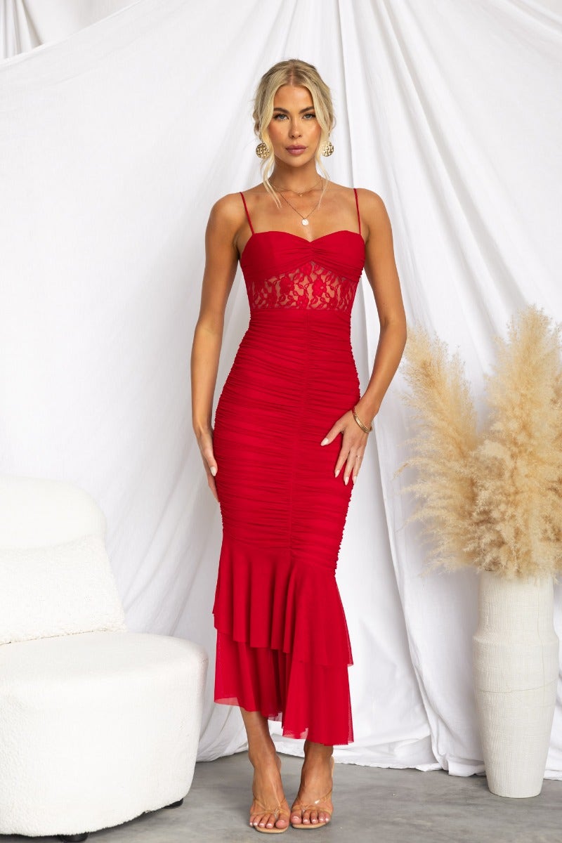 Striking red bodycon maxi dress with lace panel, adjustable straps, and ruching details, ideal for special occasions.