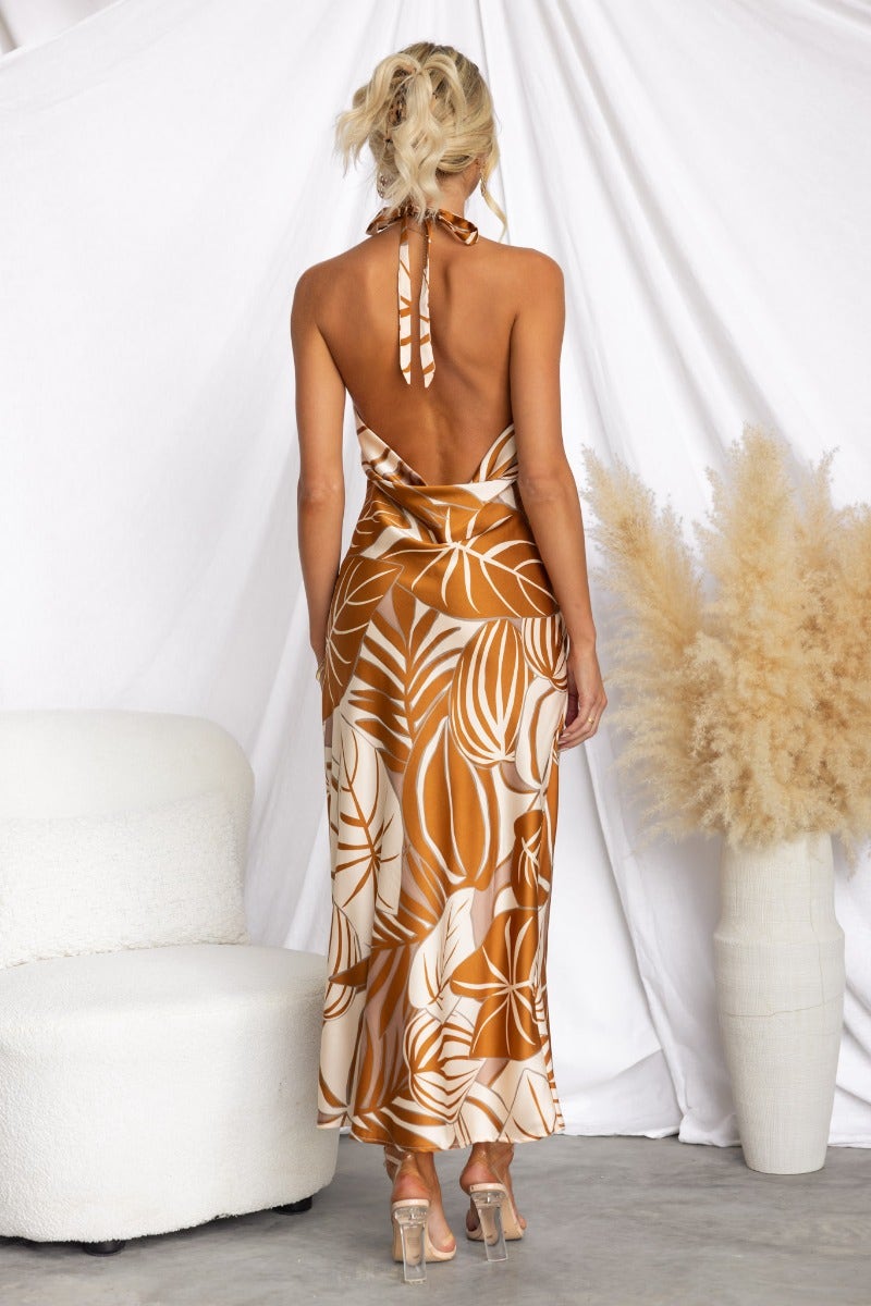 Back view of Shining Now Maxi Dress featuring floral print, high tie neckline, and draping detail.
