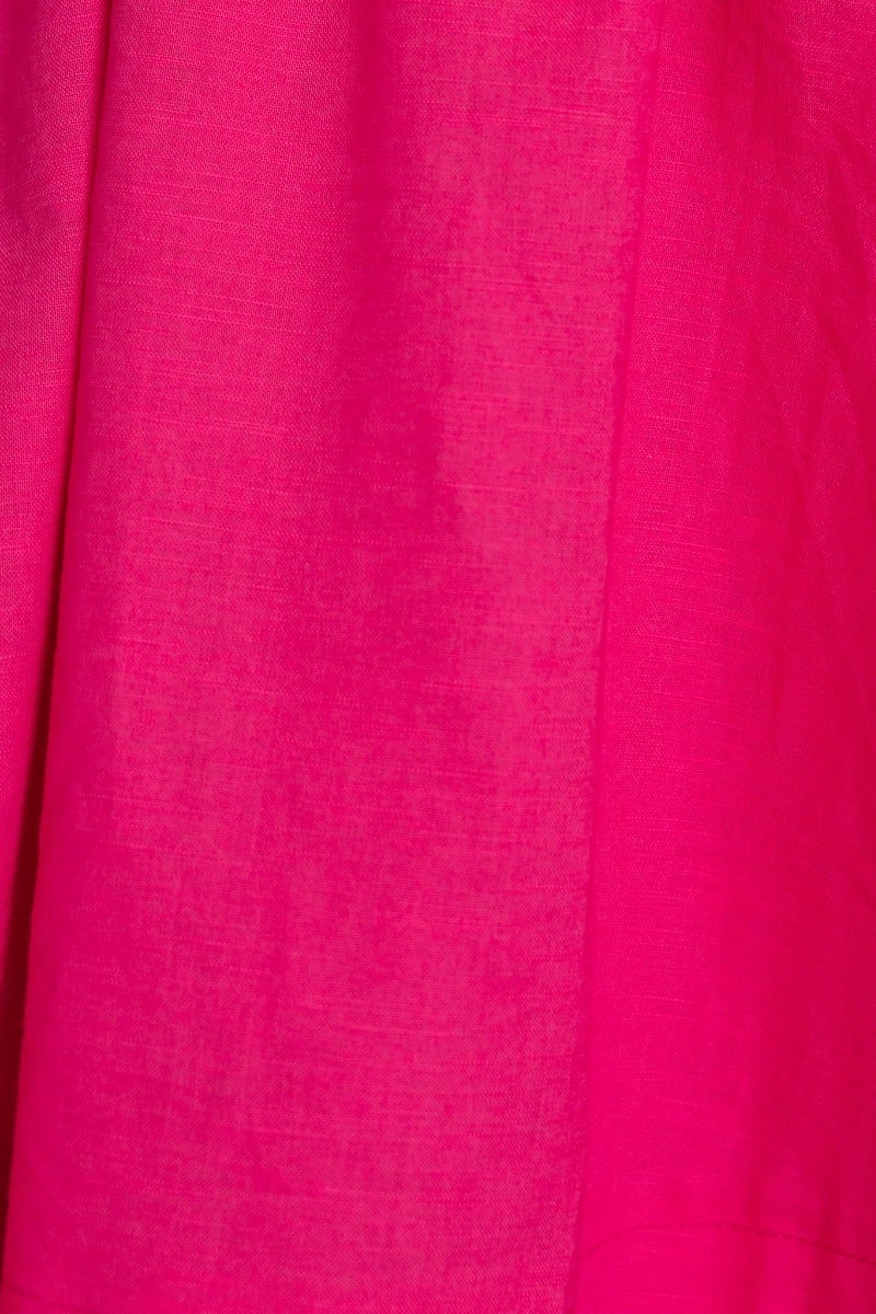 Close-up of soft pink linen fabric, showcasing texture and vibrant color, ideal for a stylish Pink Flamingo Dress.