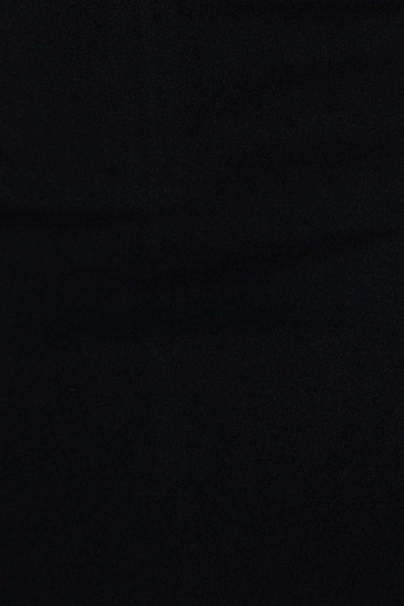 Close-up of smooth black fabric, highlighting the elegant texture of a bodycon maxi dress.