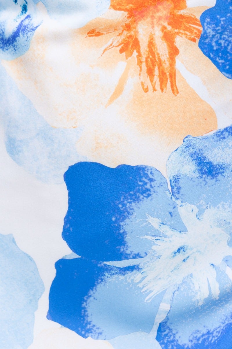 Colorful floral print featuring blue and orange flowers, ideal for a summer maxi dress.