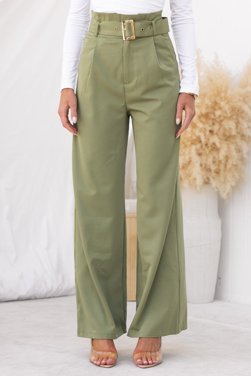 No Strings Pants in olive green with paperbag waist, removable belt, and wide-leg fit, styled with a white top.