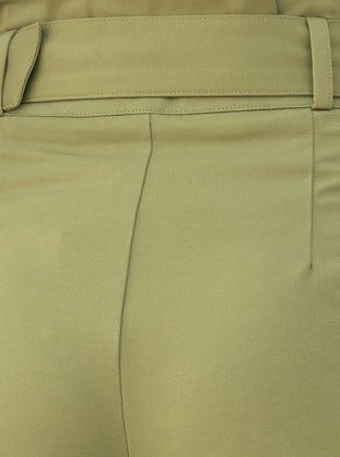 Back view of No Strings Pants featuring paperbag waist and smooth fabric in a light green color.