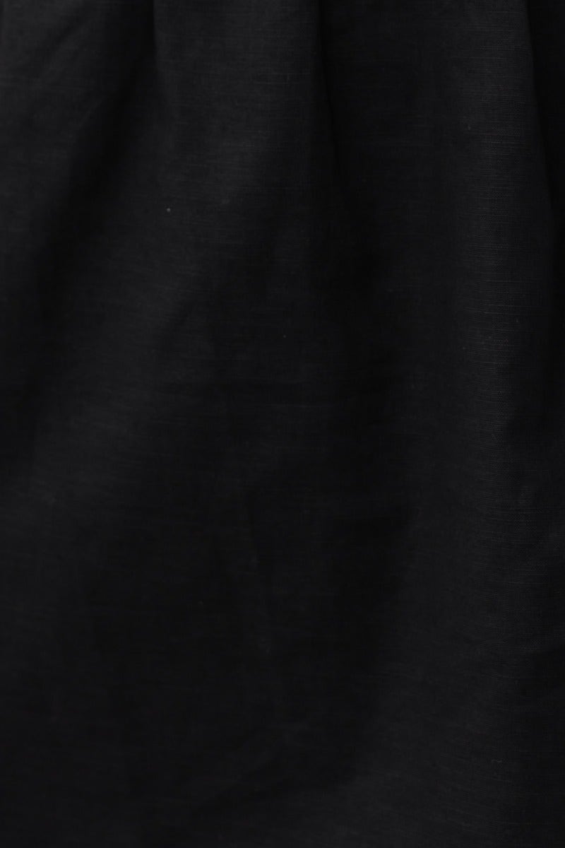 Close-up of black linen blend fabric, showcasing texture and color, ideal for the Angelica Dress.