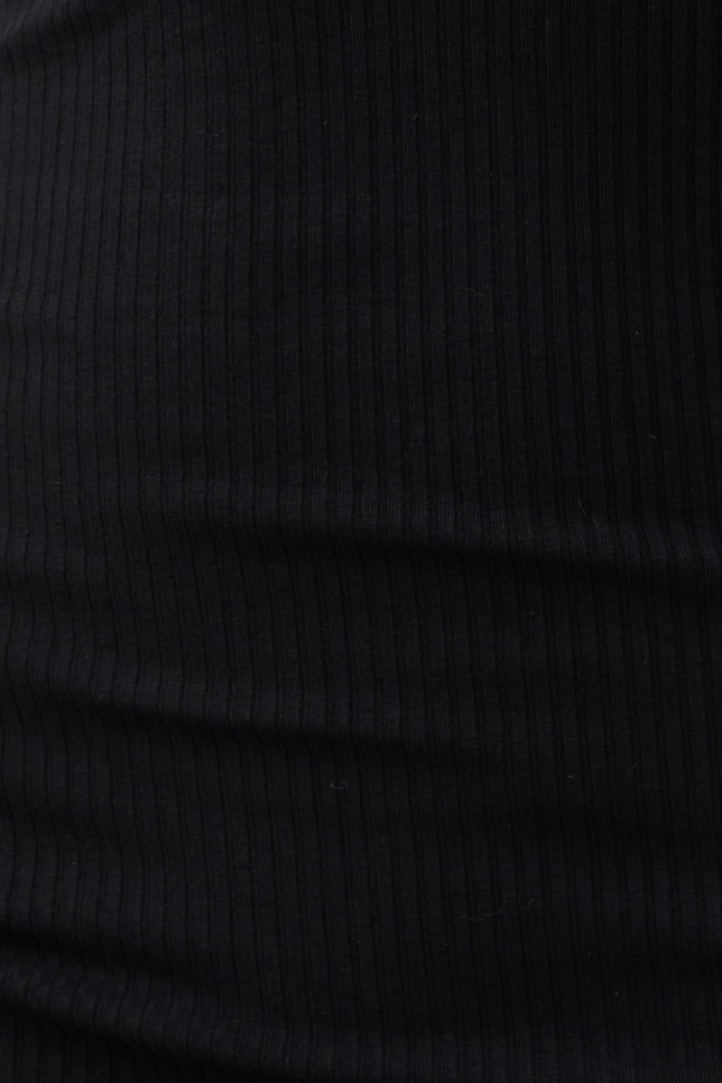 Close-up of soft ribbed black fabric, highlighting the texture and stretch of the Knoxie Midi Dress.