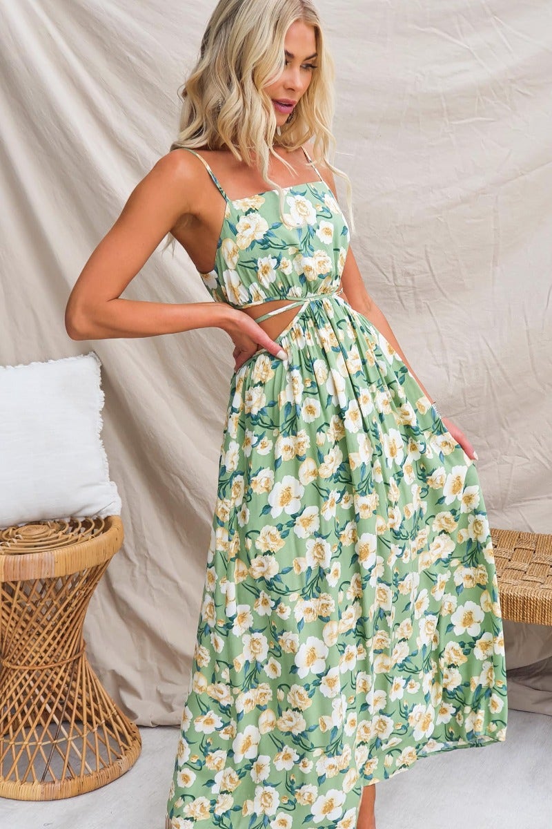 Floral print Juliette maxi dress with adjustable straps and cut-out waist, styled in a light cotton fabric.