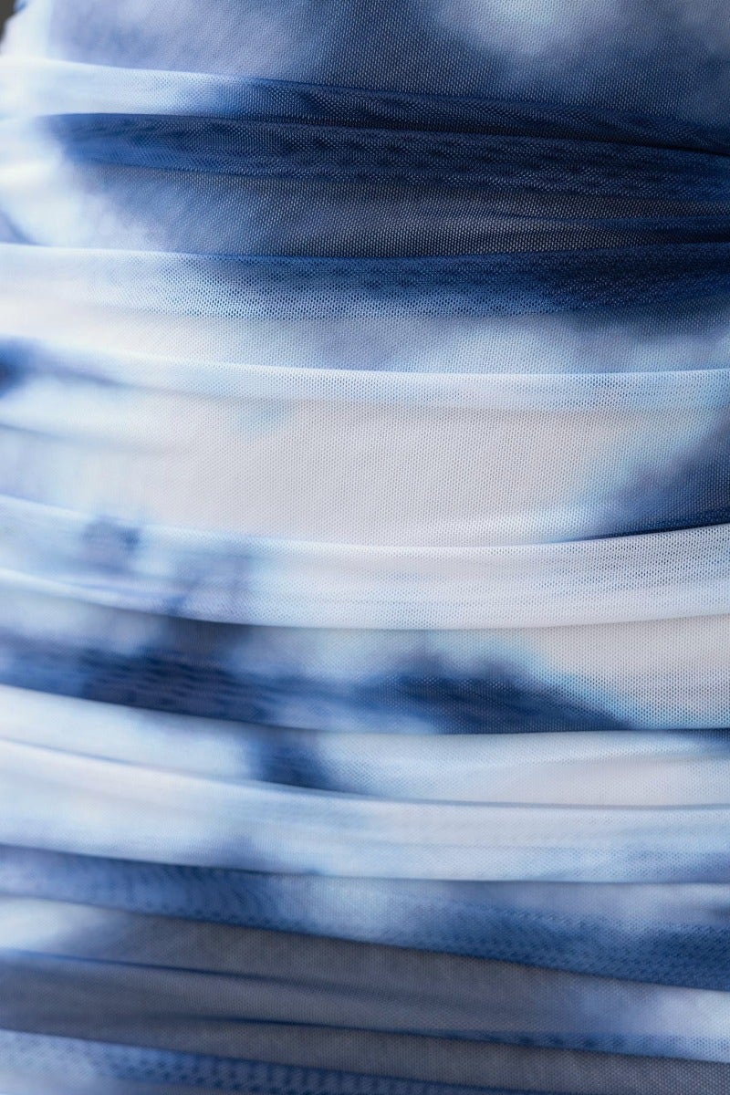 Lush blue and white layered fabric of Ravyn Maxi Dress showcasing ruching and stylish pattern.