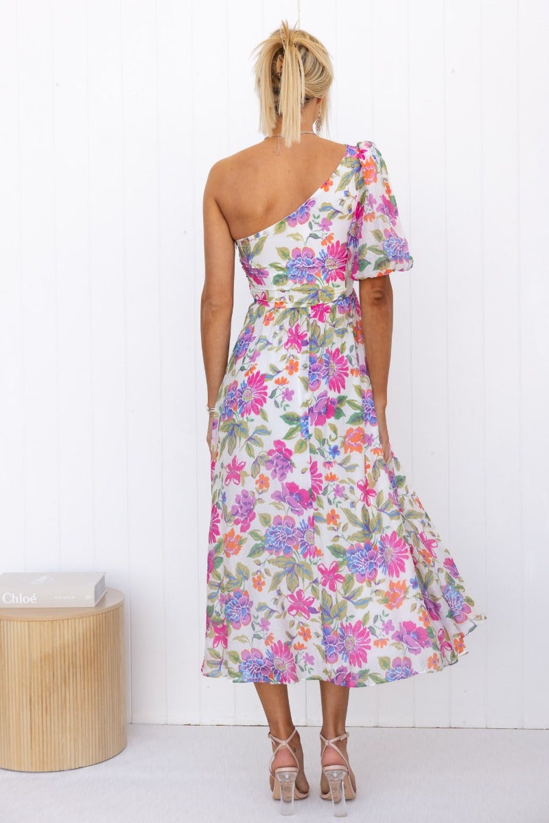 Back view of Woran Midi Dress featuring colorful floral print and one-shoulder design.