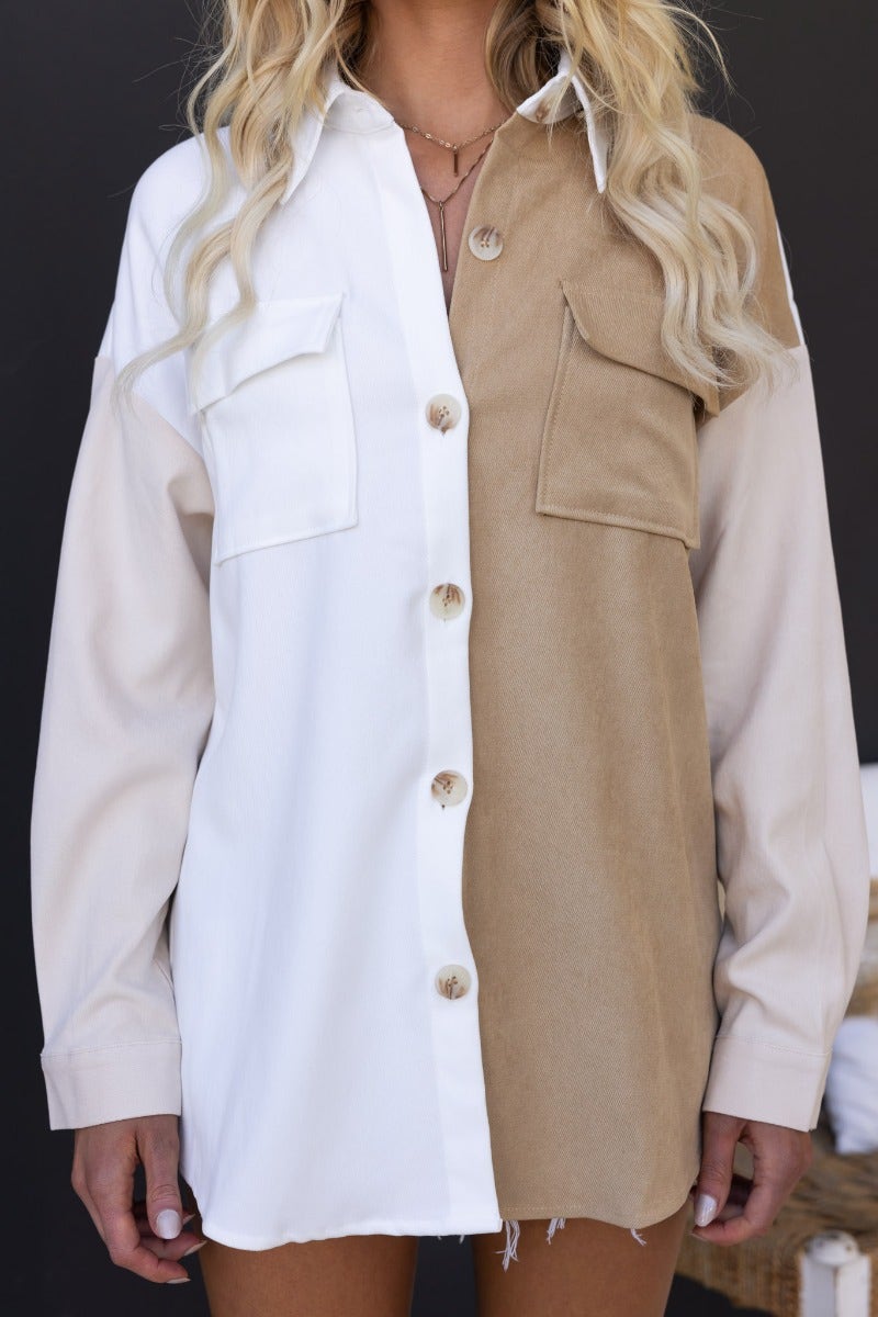 Baxter Shirt featuring a unique split design in white and beige, button-up front with chest pockets and relaxed fit in 100% cotton.