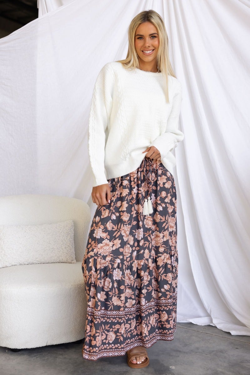 Model wearing Gino Jumper with a floral maxi skirt, showcasing a stylish casual look.