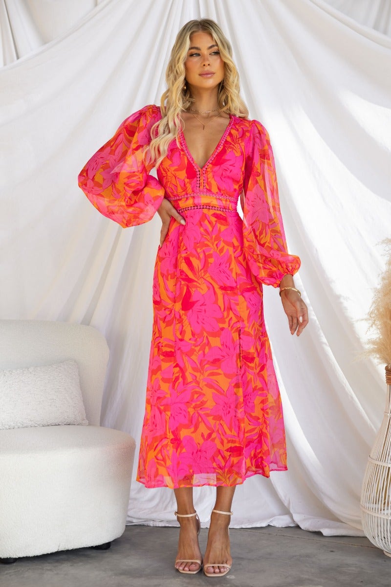 Zaida Midi Dress featuring a vibrant floral print, V-neckline, and elastic sleeve cuffs, perfect for elegant occasions.
