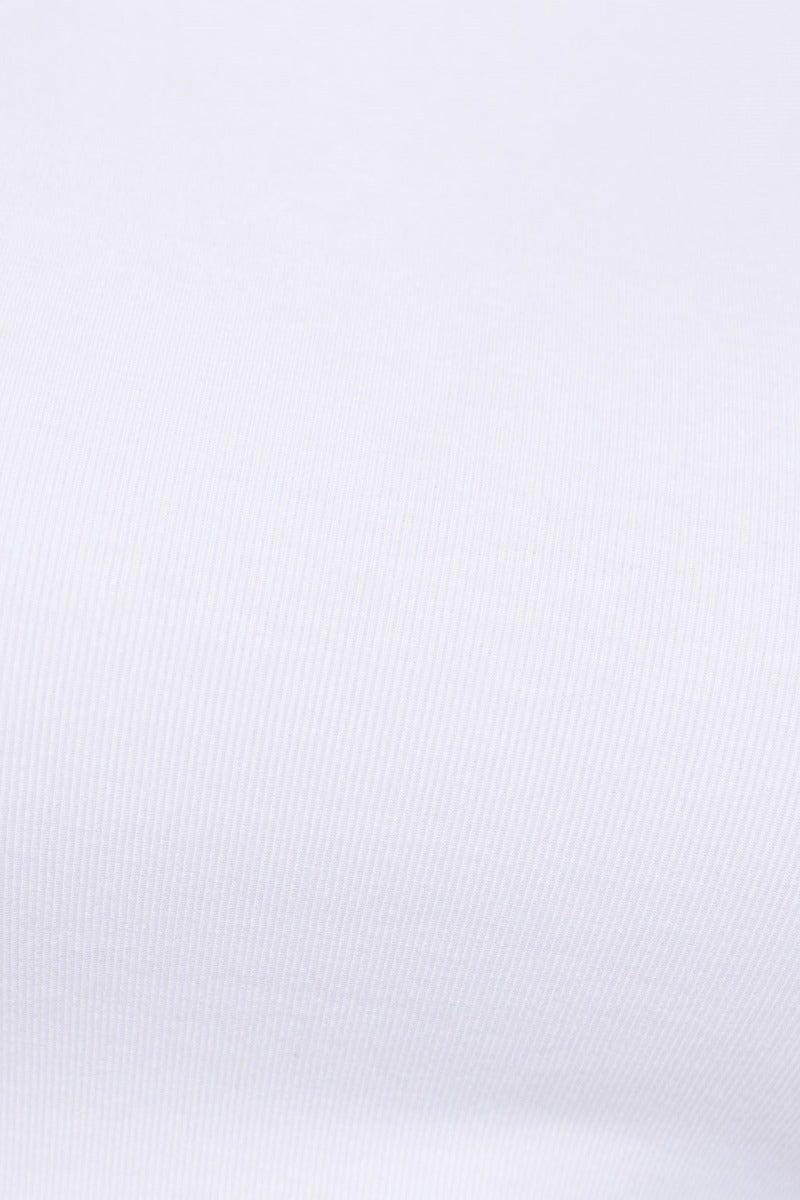 Close-up of white cotton fabric texture, showcasing soft and stretchy material, ideal for clothing like tops.