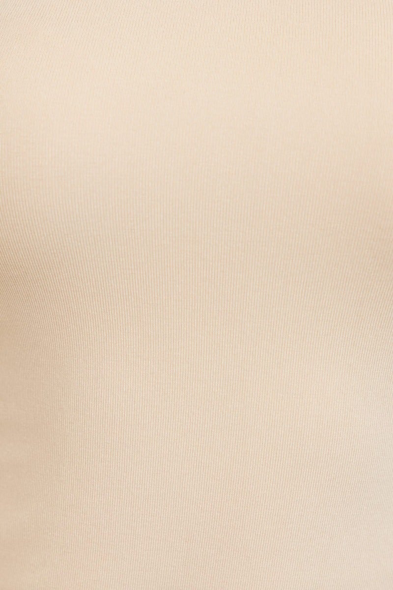 Close-up view of a beige fabric texture, showcasing a smooth and stretchy cotton material ideal for casual tops.