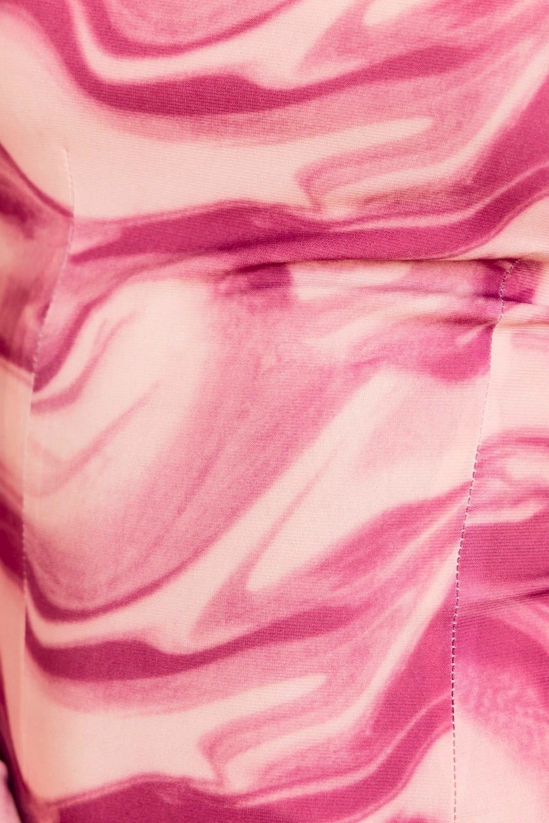 Close-up of Qara Midi Dress fabric featuring a multi-colour swirl pattern in pink tones.