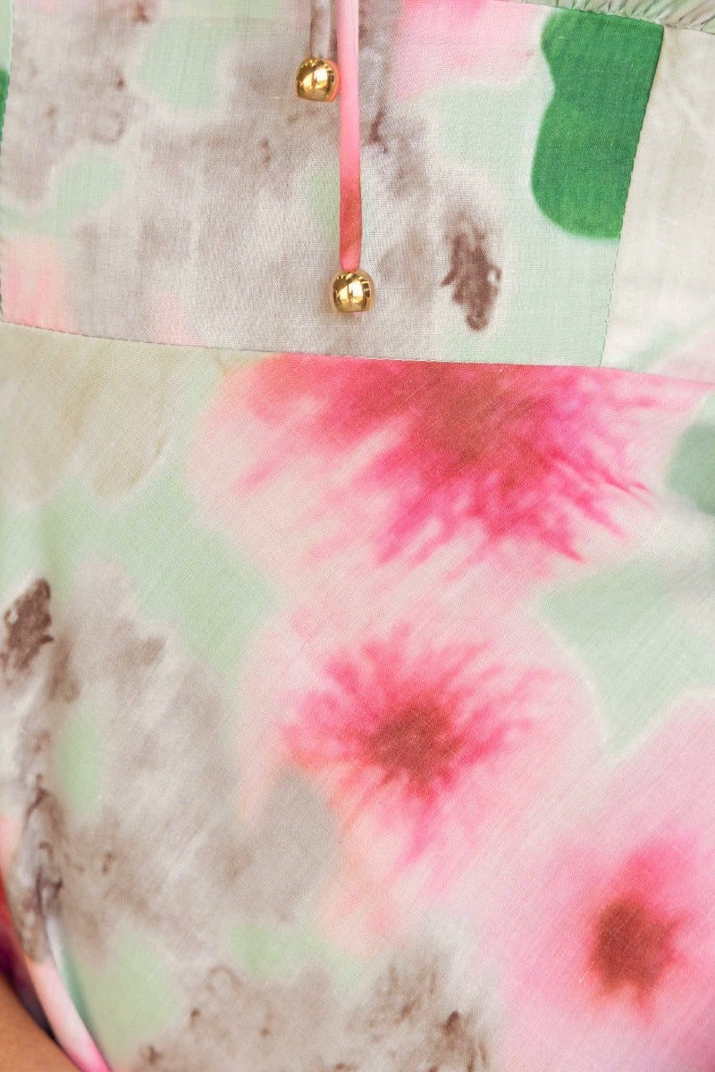 Close-up of floral print detailing on Eyre Maxi Dress with elastic fittings and tie detail at bust.