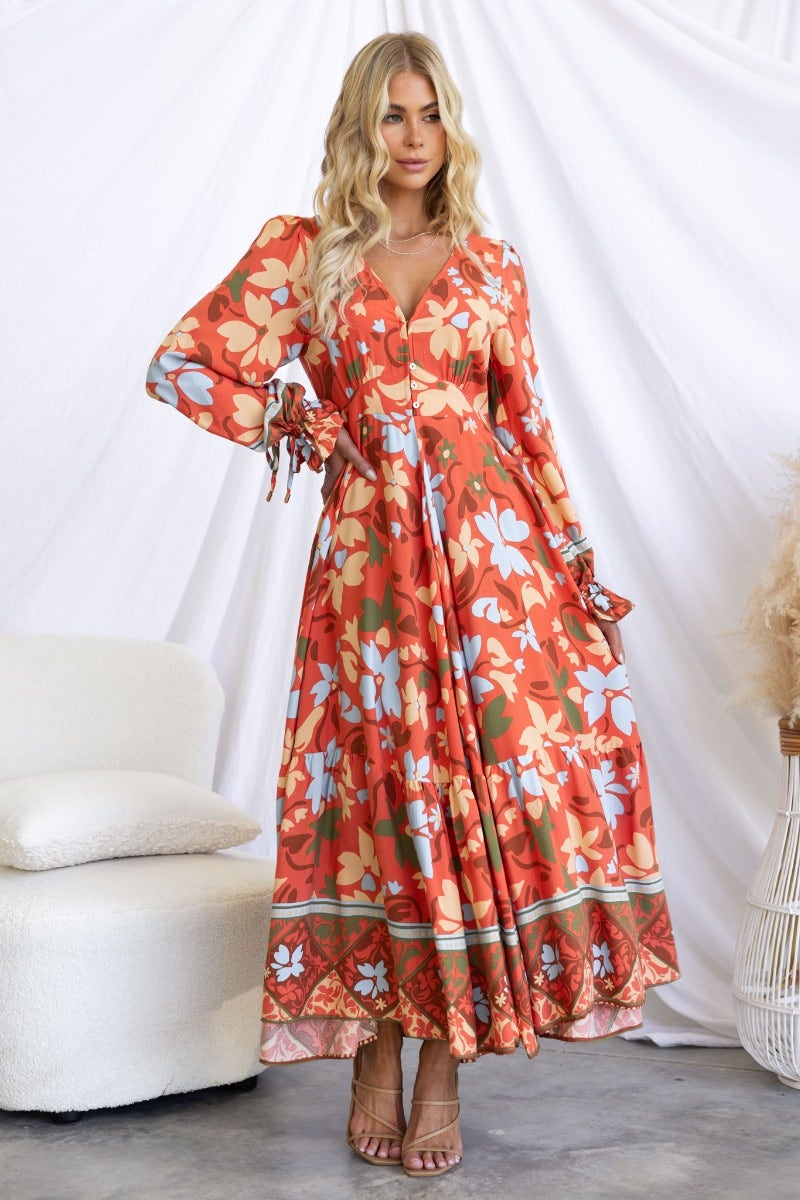 Floral print Taniah maxi dress with V-neckline and elastic sleeves, perfect for casual or special occasions.