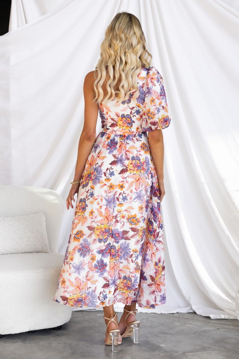 Back view of Woran floral print midi dress featuring one-shoulder neckline and elegant design.