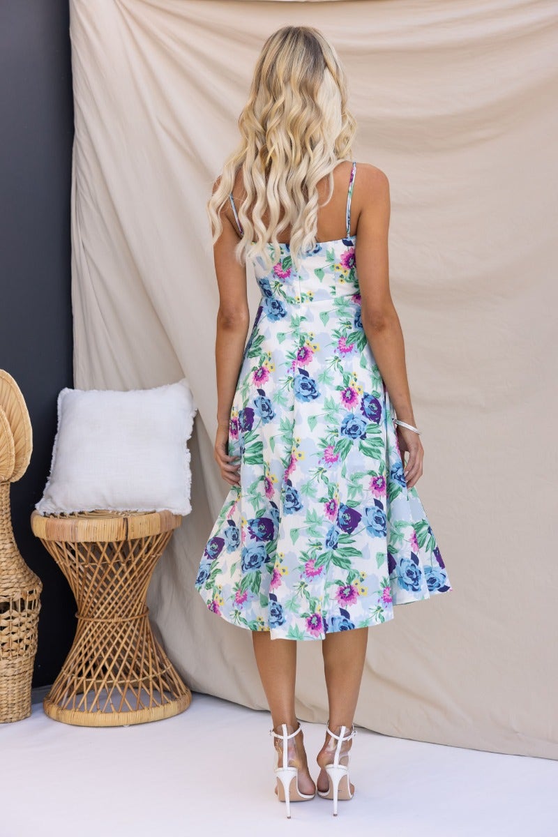 Back view of Rekiah Midi Dress showcasing floral print and flowing silhouette, perfect for summer occasions.