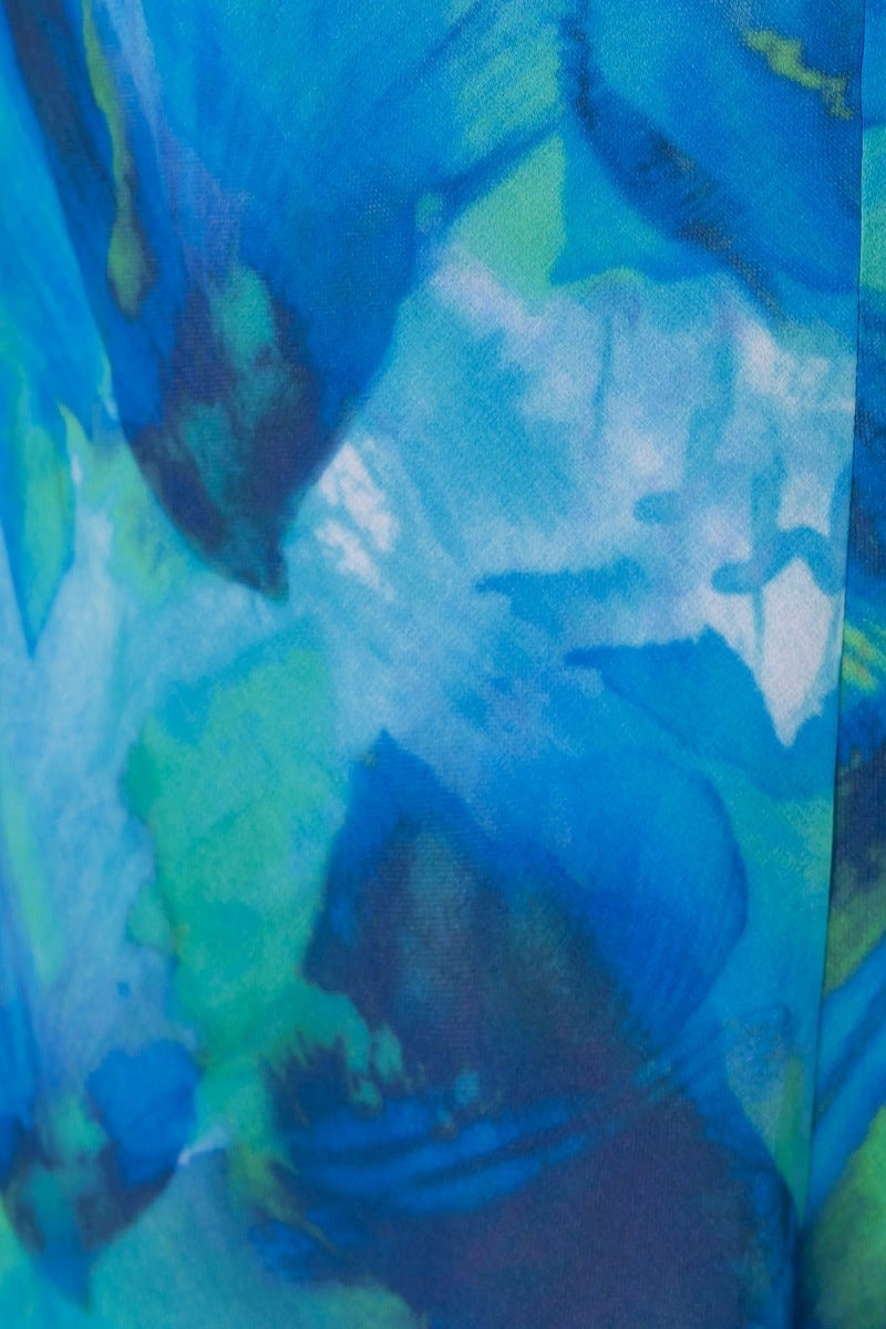 Close-up of blue and green floral print fabric for Rhai Midi Dress, featuring a vibrant multi-colour design.