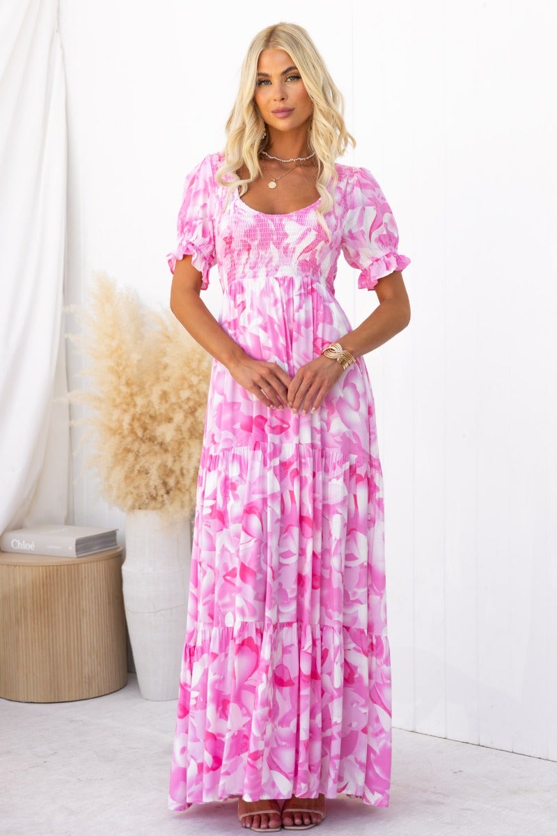 Sheridan Maxi Dress in pink floral print, featuring a V-neckline and elastic bodice, perfect for summer wear.