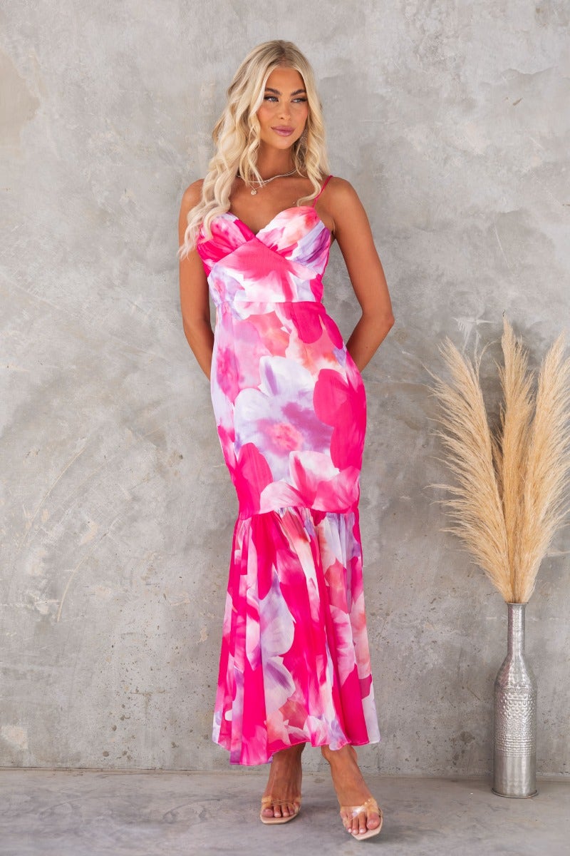 Forget Me Maxi Dress in vibrant floral print, featuring adjustable straps and a stylish flared hem.