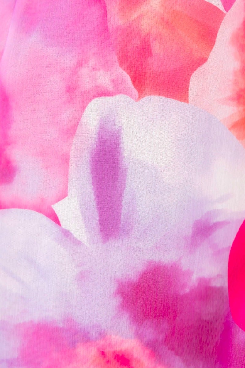 Close-up of vibrant pink floral fabric pattern, showcasing soft hues and watercolour effect for fashion design.