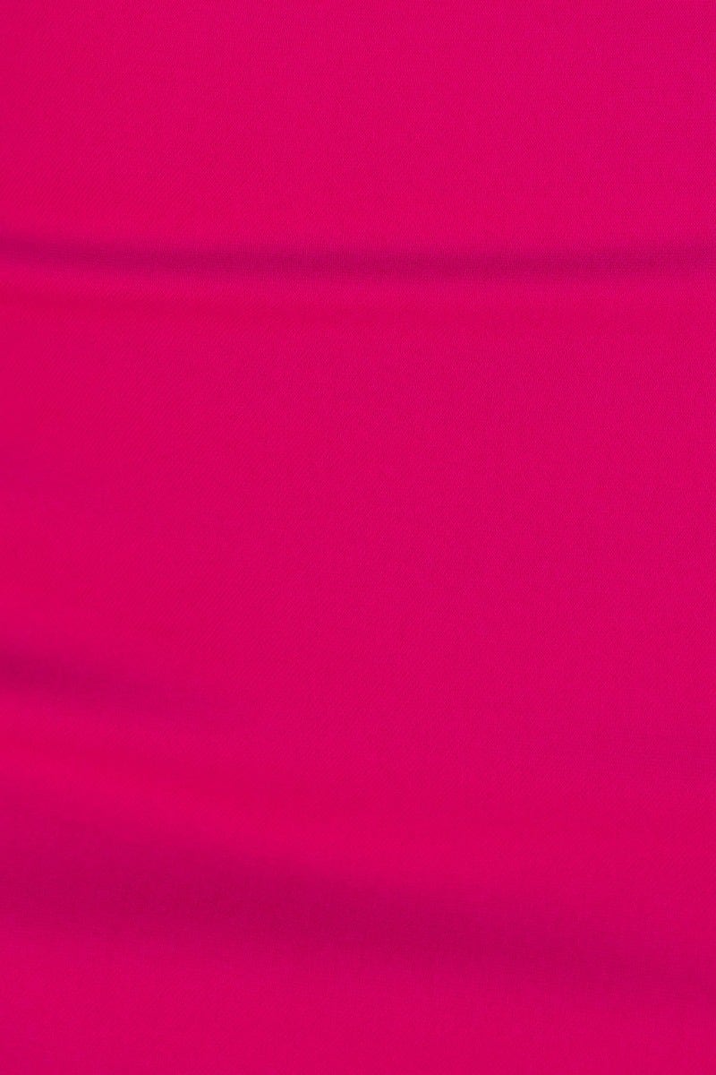Close-up of vibrant pink fabric showcasing smooth texture for Monroe Midi Dress.
