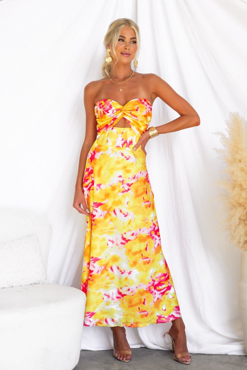 Electric Touch Maxi Dress in vibrant yellow and pink floral print, featuring a strapless design and cut-out at bust.
