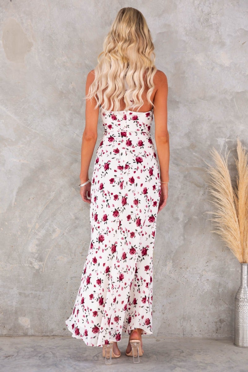 Back view of Love Language Maxi Dress featuring a floral print, adjustable tie straps, and cowl neckline.