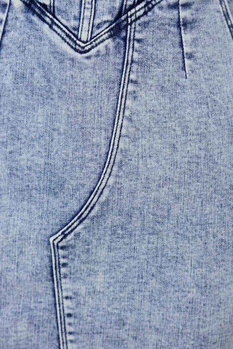 Close-up of Maverick denim dress fabric showing the texture and stitching details.