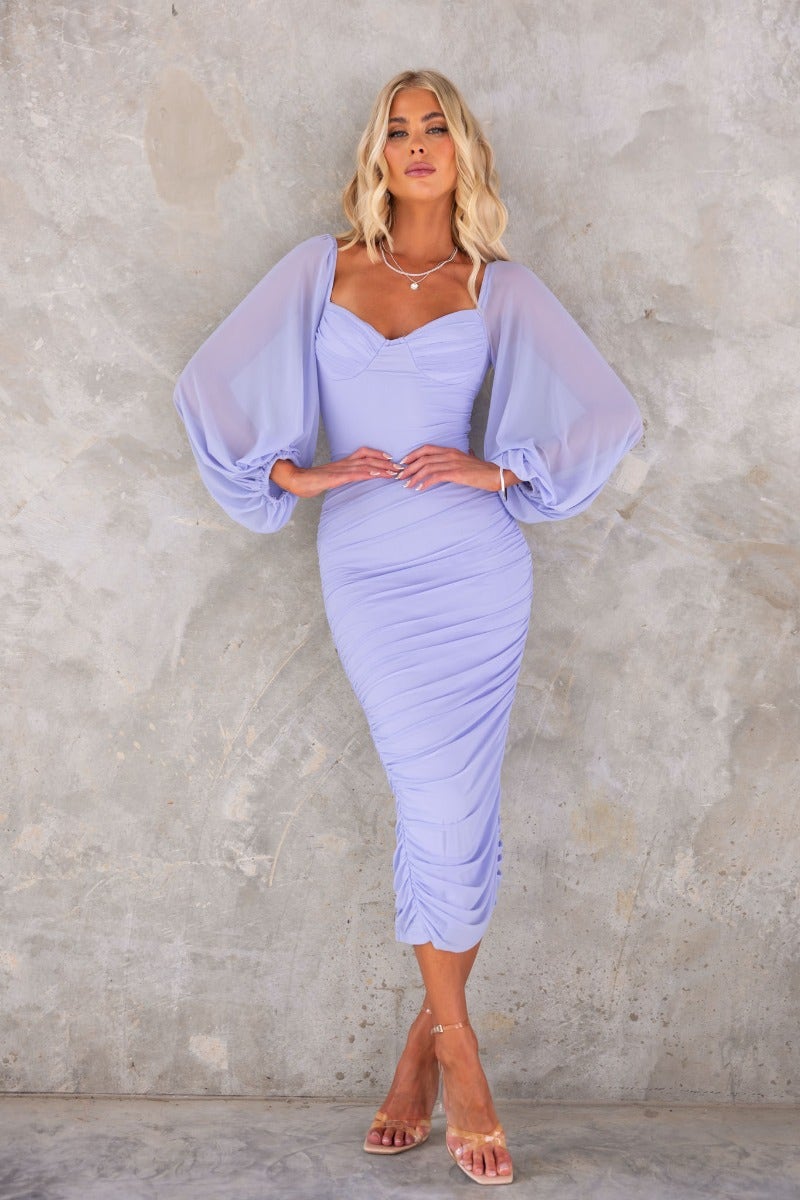 Malakai Midi Dress in lilac with mesh sleeves, ruching details, and elegant back tie. Perfect for special occasions.