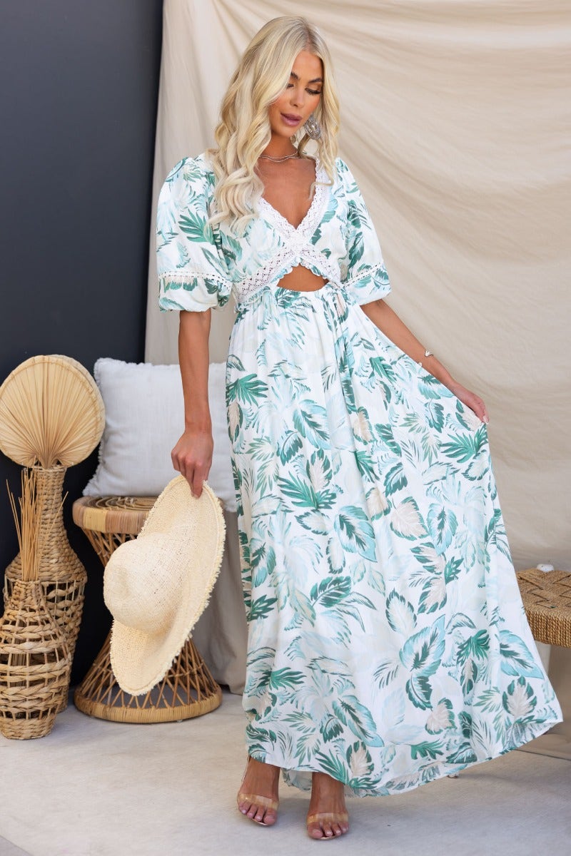 Floral print Out Of Sight maxi dress with V-neckline and cut-out waist, styled with a straw hat.