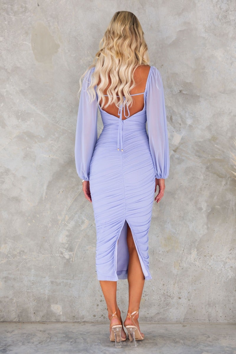 Back view of Malakai Midi Dress in lavender with tie detail, ruched sides, and split at back.