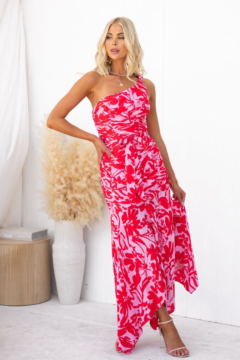 Escoda Maxi Dress featuring floral print, one-shoulder neckline, and asymmetric hem for a stylish summer look.