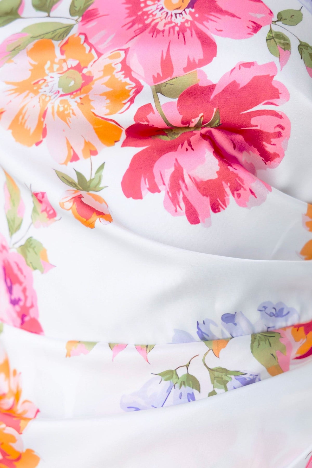 Vibrant floral detail on the Levona Maxi Dress in pink and orange hues, showcasing exquisite satin-like fabric.