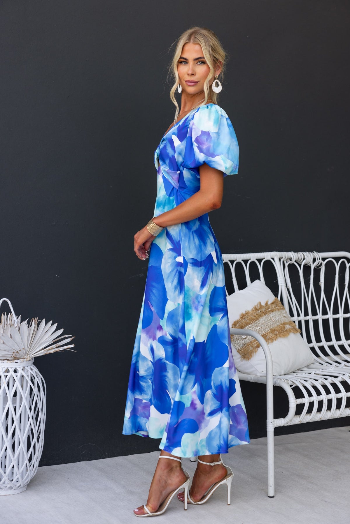 Qeilor Midi Dress featuring floral print, V-neckline, elastic sleeves, and lightweight material, modeled by a woman.