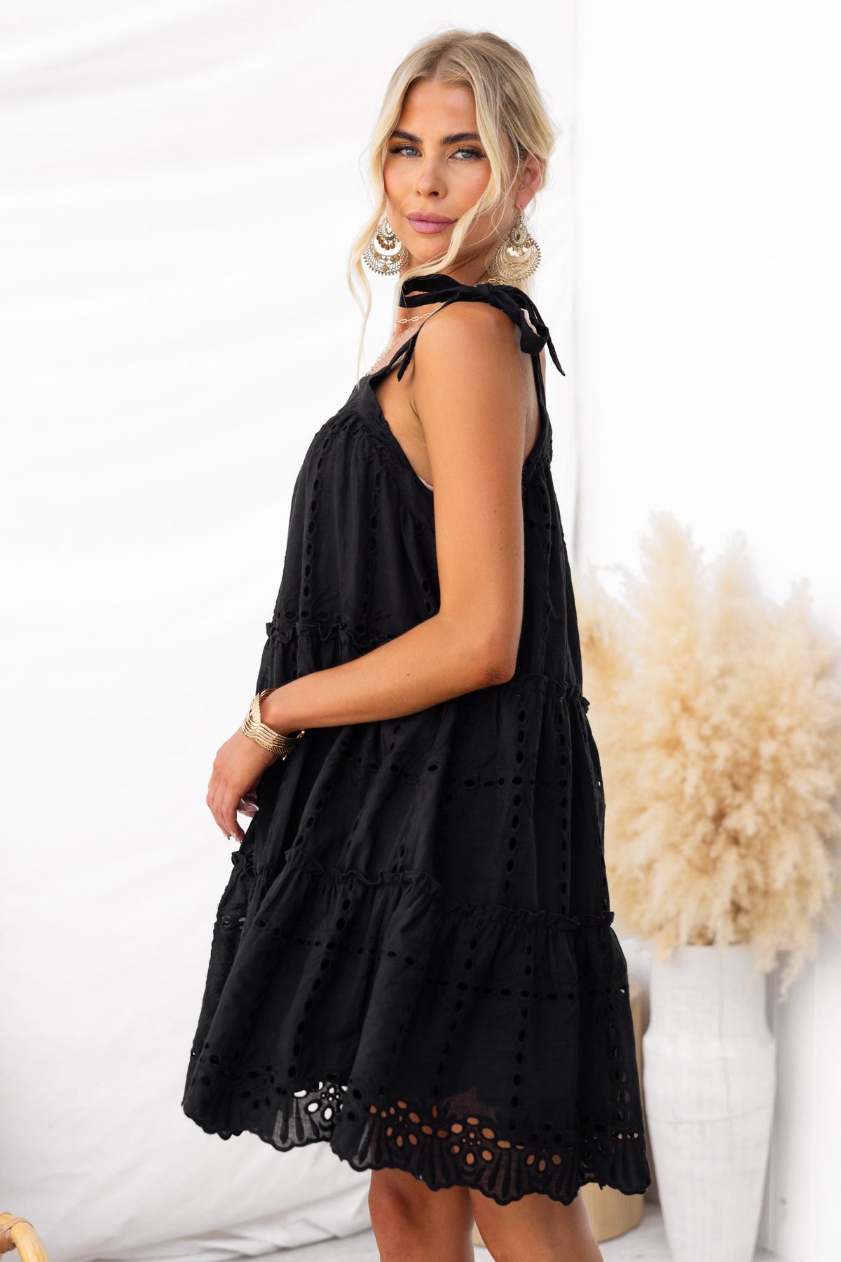 Charlene Dress: Black Anglaise dress with adjustable tie straps, relaxed fit, perfect for any occasion.
