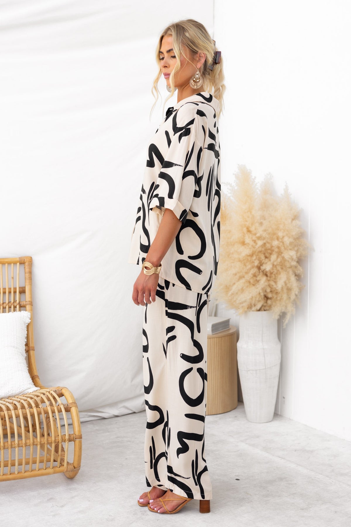 Model wearing the Arwen Set featuring a stylish abstract print, linen-like texture, and non-stretch pants.