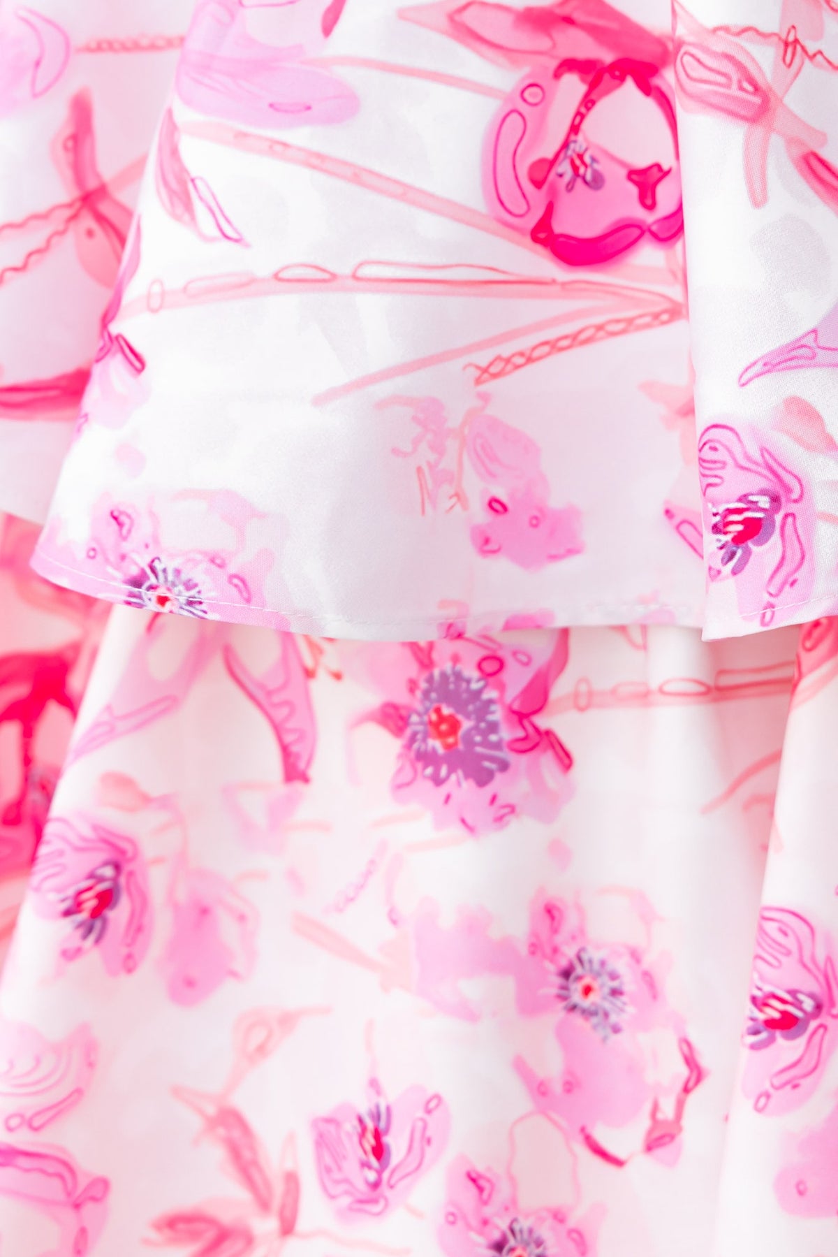 Floral pink print fabric detail of the Illusion Set featuring ruffles and gathered design elements.