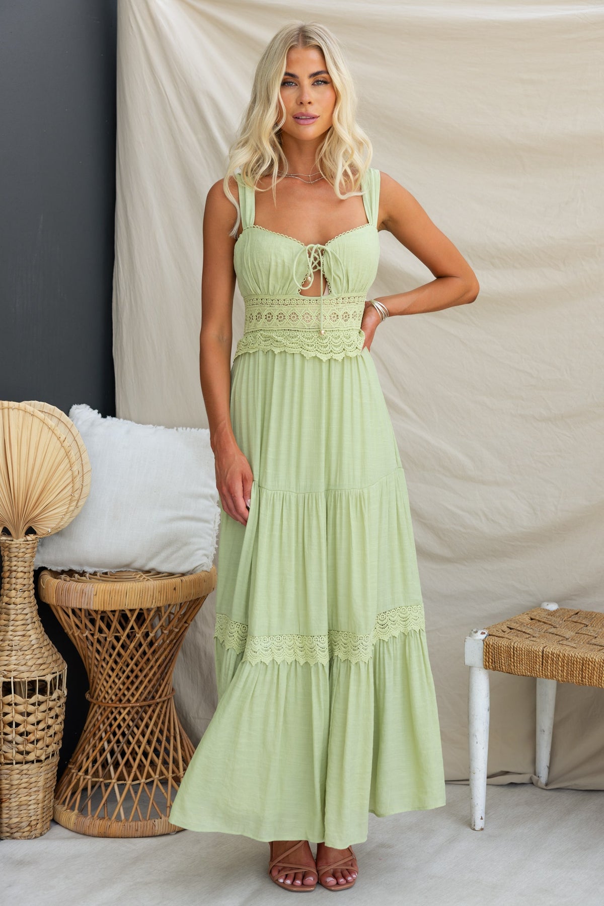 Flaria Maxi Dress in light green with lace detail, tie bust, and flowing skirt for a stylish summer look.