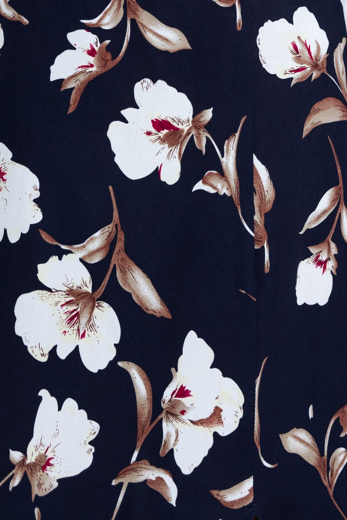 Close-up of navy midi dress fabric featuring white and brown floral print design.