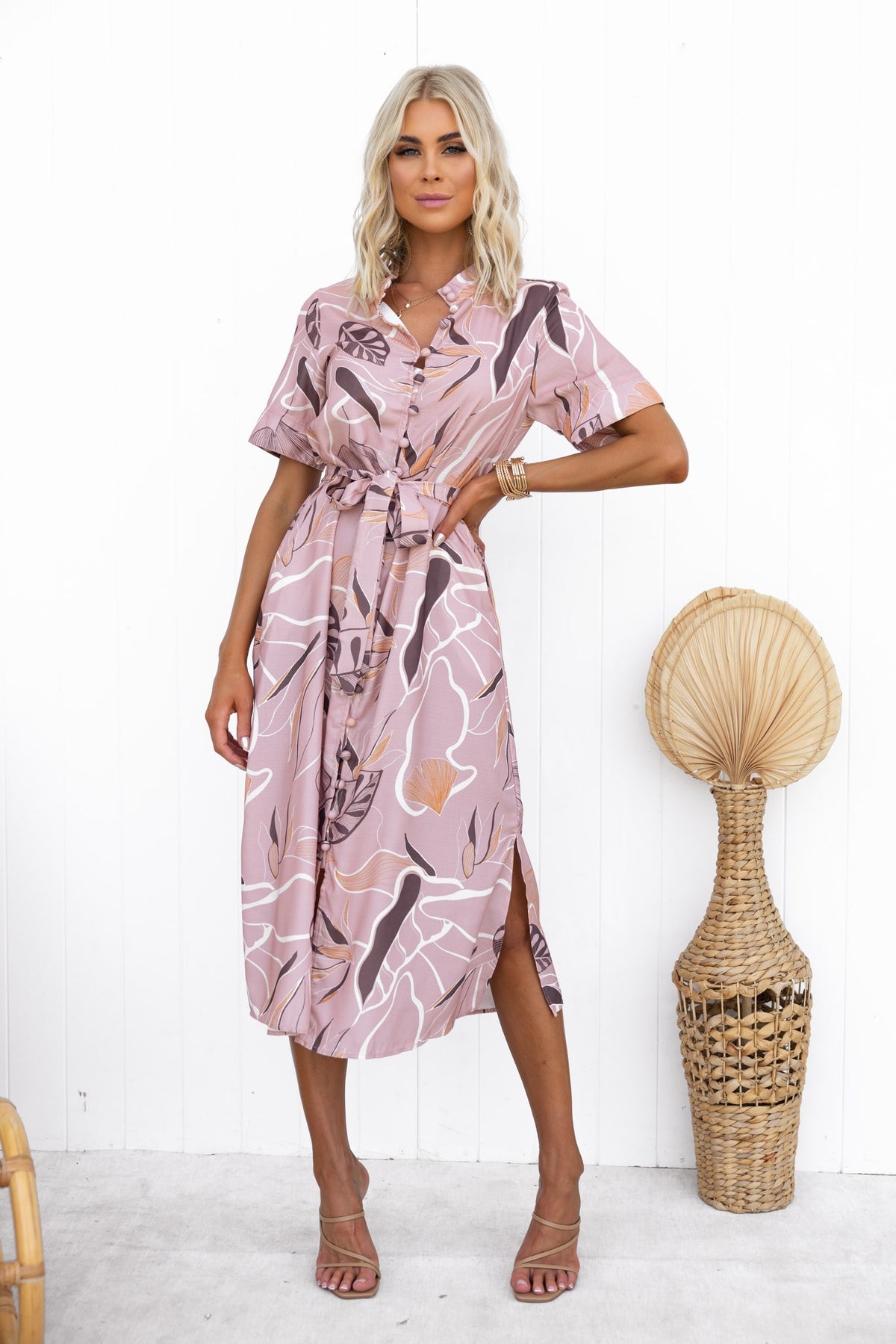 Stylish Jubell Midi Dress in pink with button-up front, side split, and a removable tie, perfect for warm weather.