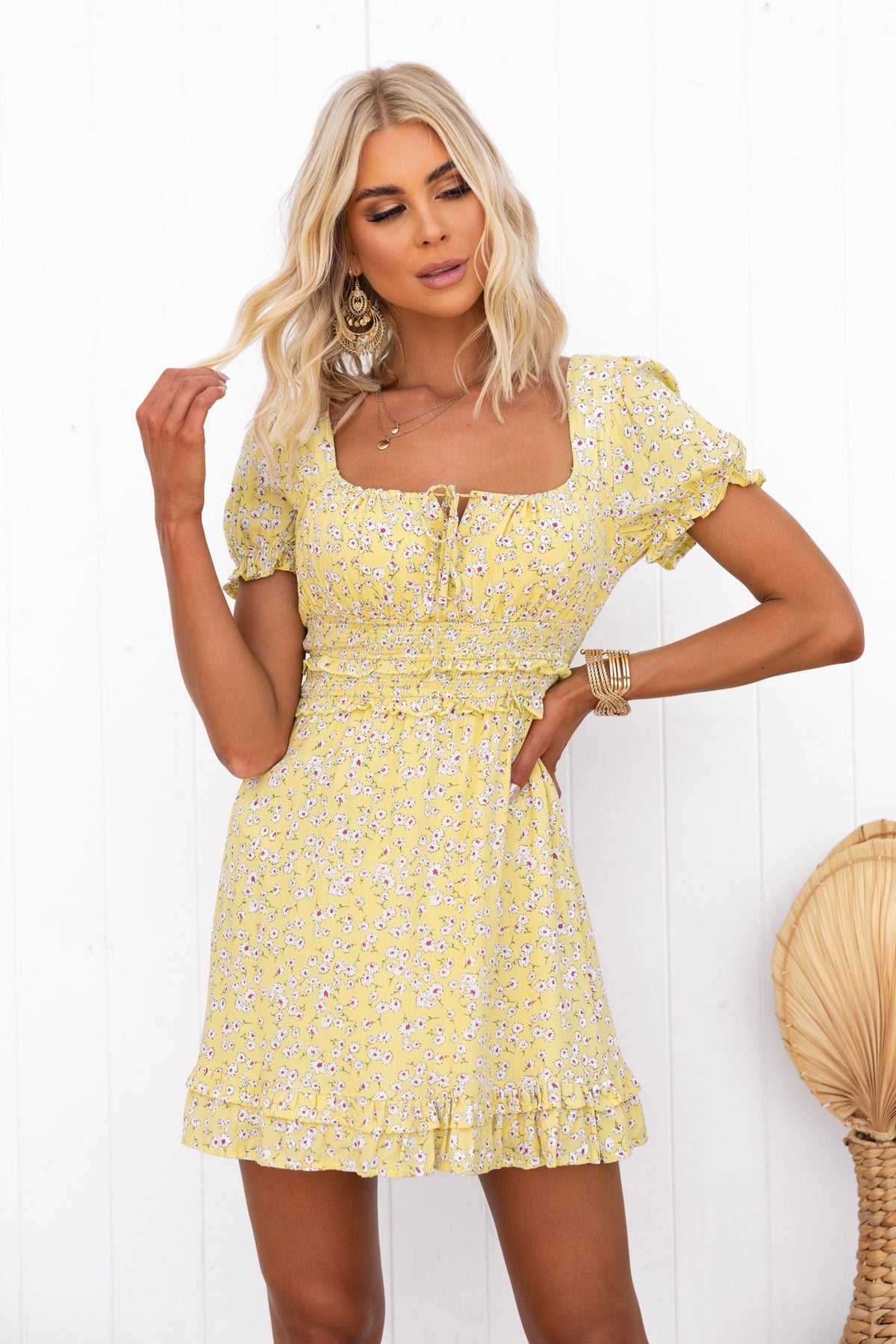 Mischa Dress in yellow floral design with puff sleeves and adjustable tie neckline, perfect for spring and summer outings.