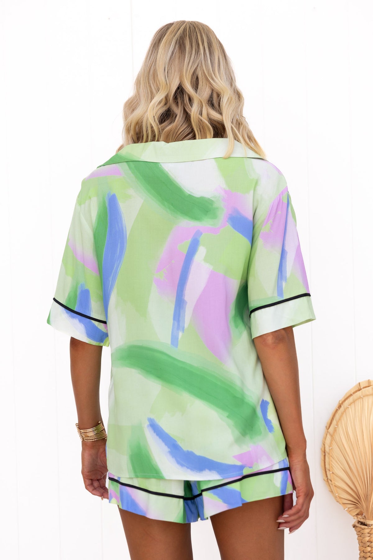 Back view of the Focus Shirt in colorful abstract print, featuring relaxed fit and modern design, ideal for casual wear.